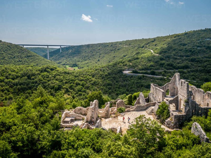 Aerial view of two tourists at Dvigrad ruins in Kanfanar, Croatia